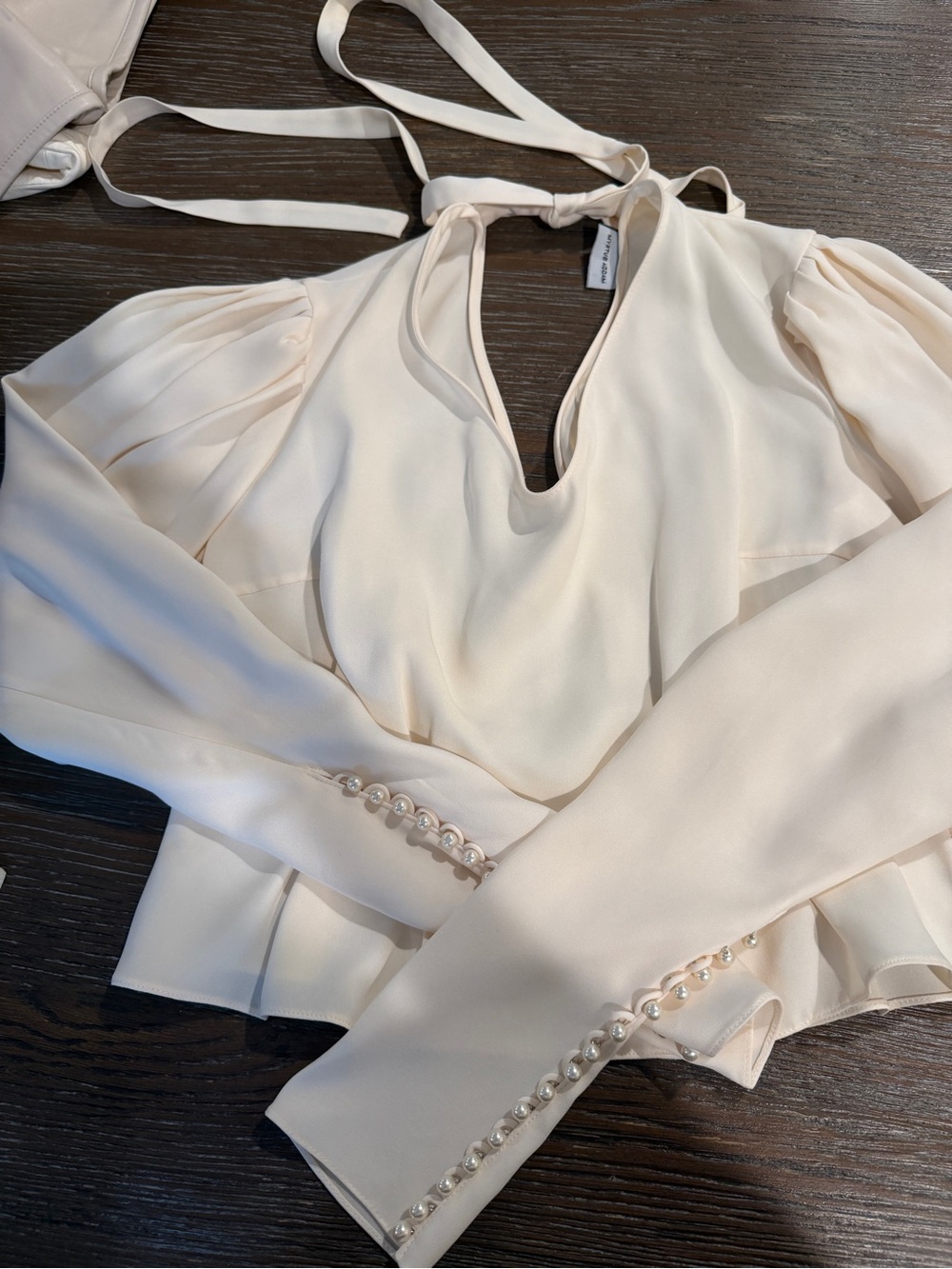 Magda Butrym Cream V‑Neck Peplum Blouse with Pearl Cuffs